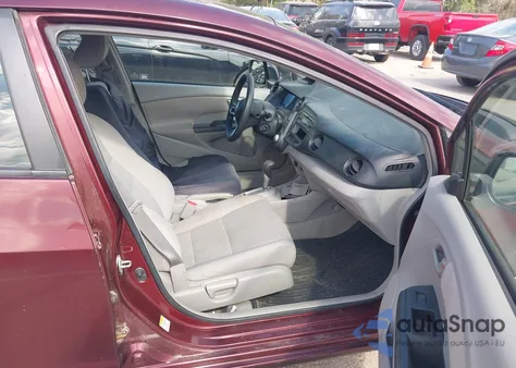 2011 Honda Insight from USA, damaged, VIN JHMZE2H37BS012364